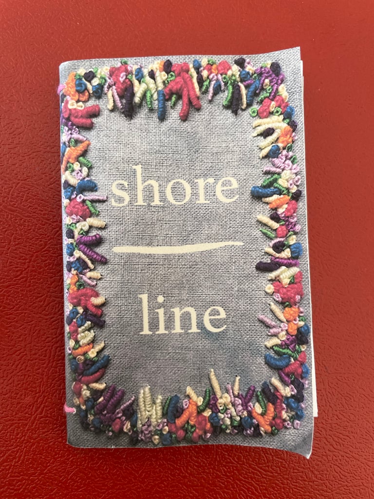 a poetry zine featuring coral embroidered on the cover