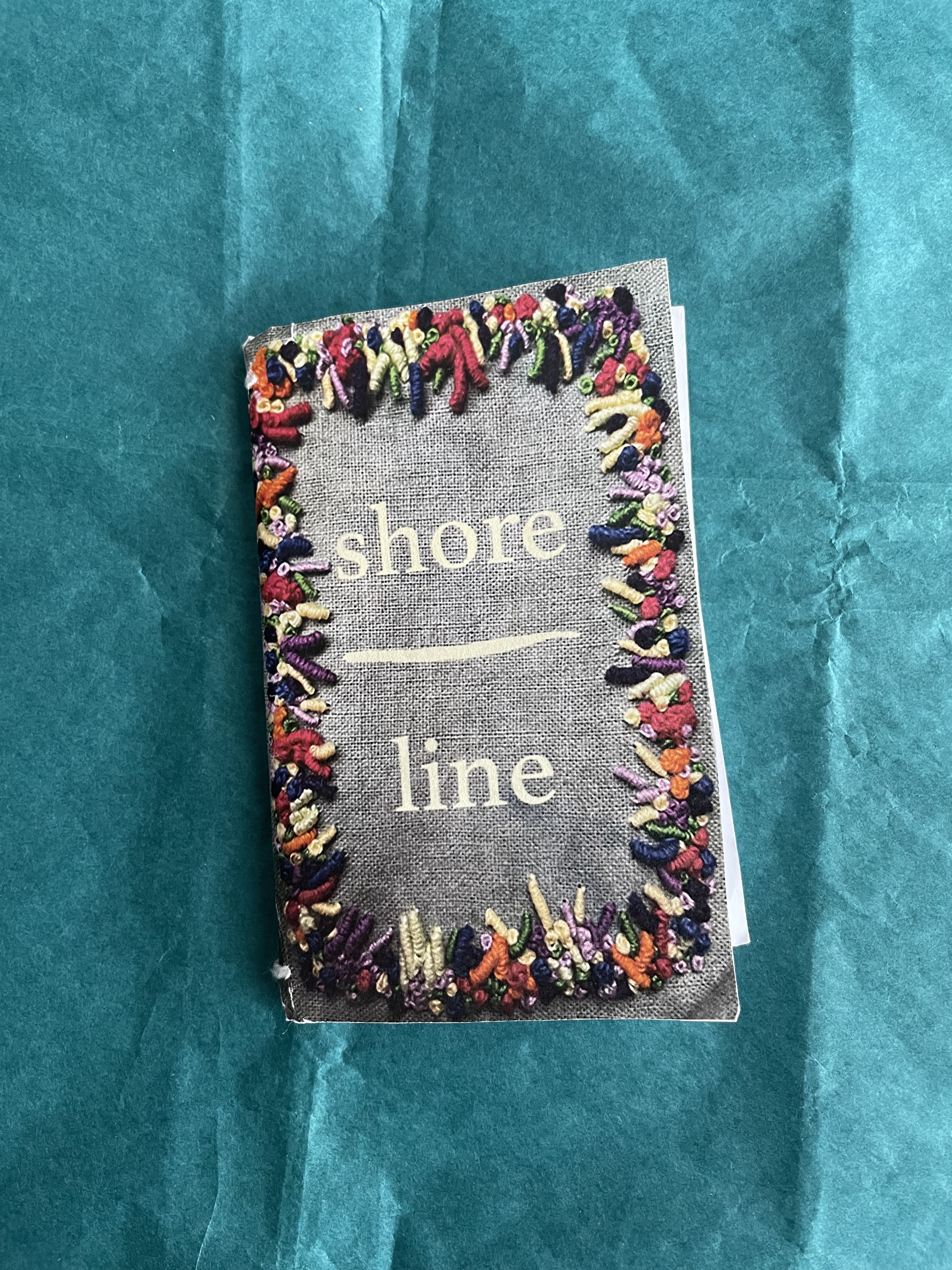 a poetry zine featuring coral embroidered on the cover