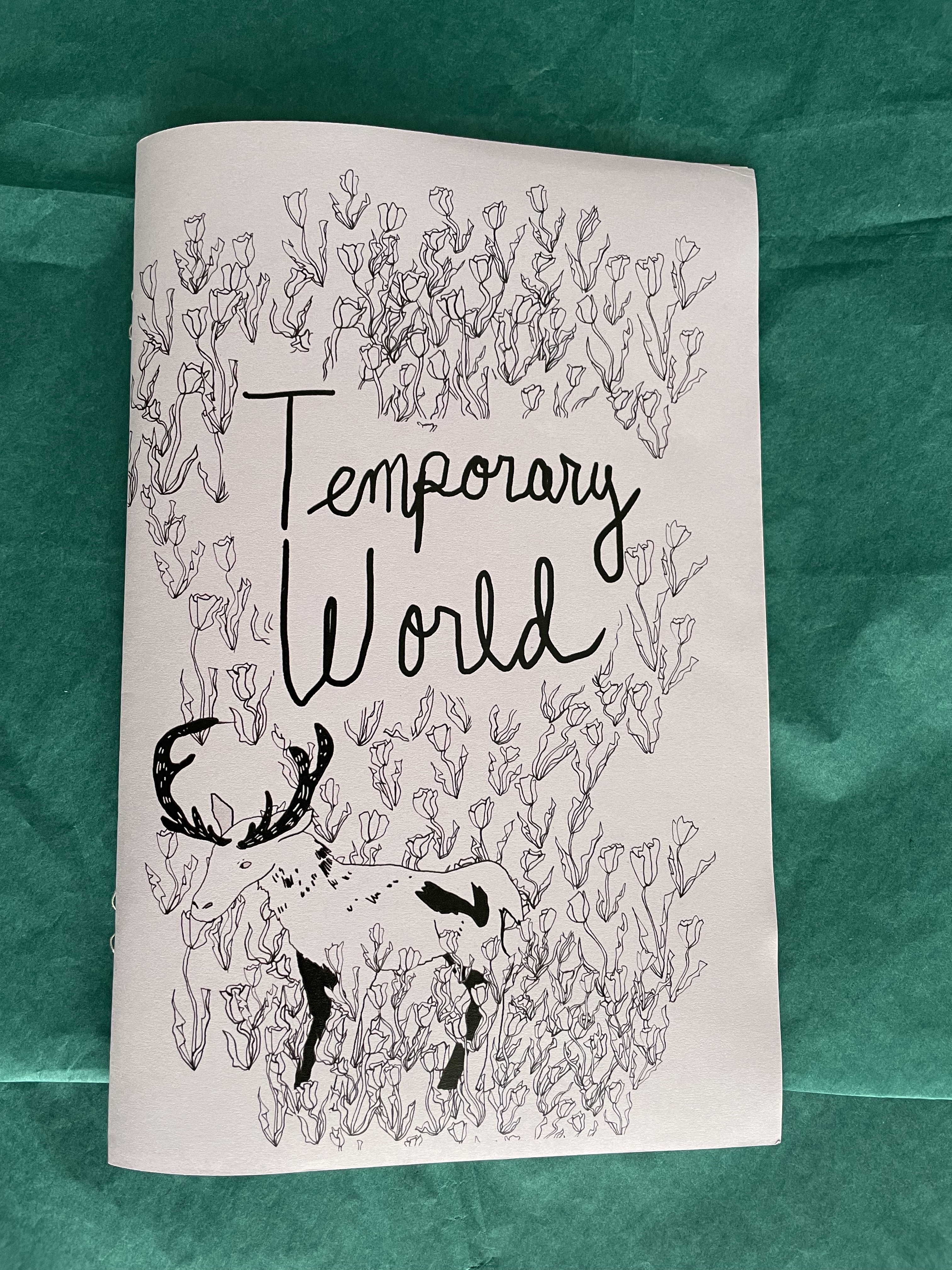 a poetry zine featuring drawings of tulips and a moose on the cover